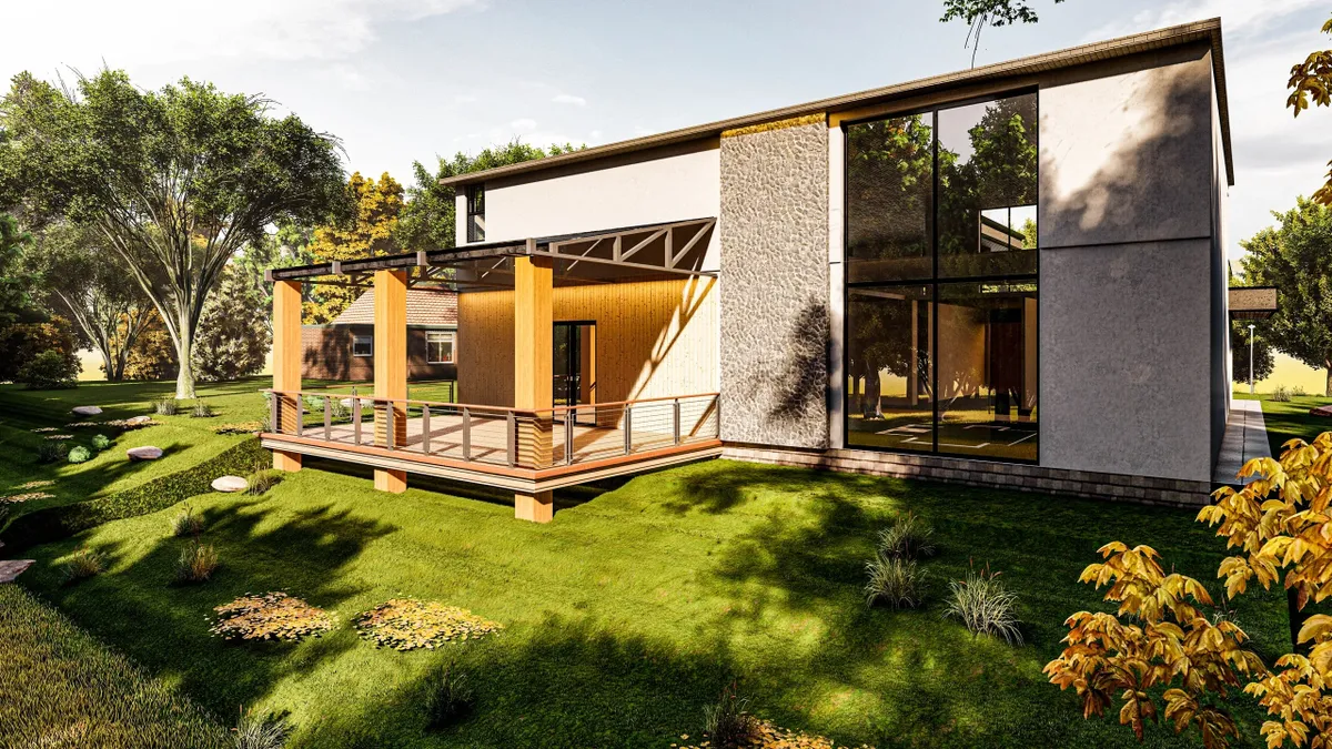 Modern house with large glass windows and wooden deck in a lush garden.